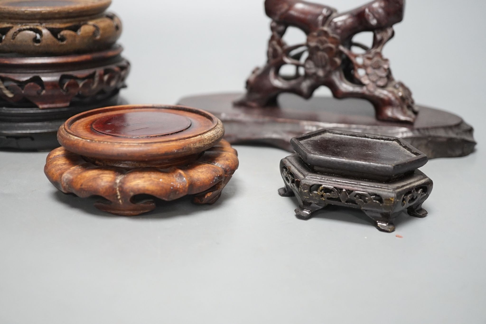 A group of 17 Chinese or Oriental hardwood stands